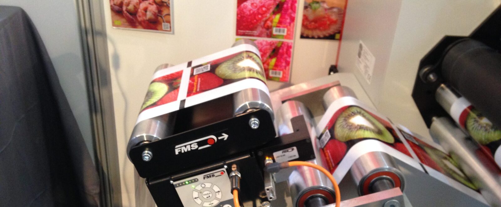 BKS015 web guiding system displayed at Labelexpo 2015, showcasing precision label control technology.