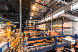 Modern manufacturing factory with fiberglass heavy industry machinery and production equipment.